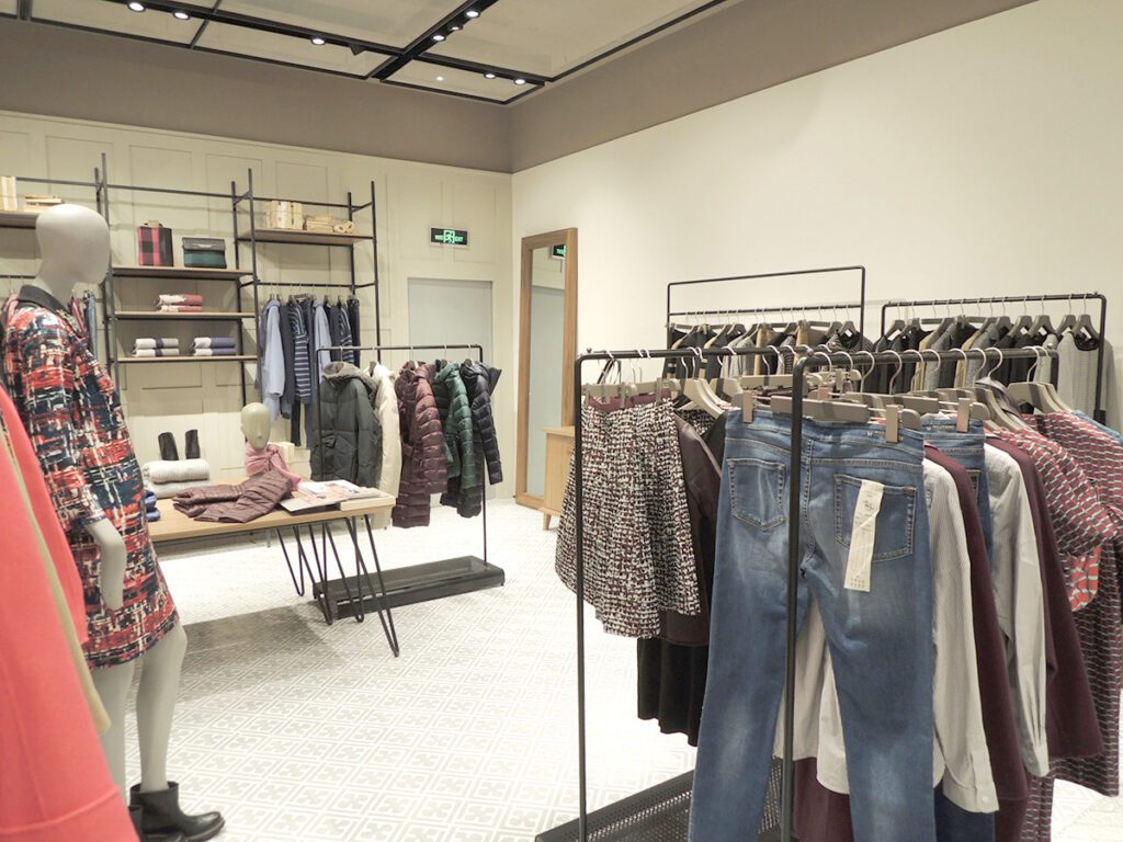 MaxMara store interior - fashion clothes display showcases and racks in the store