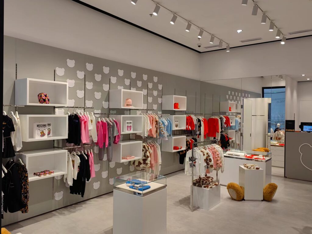 MOSCHINO store interior - fashion clothes display showcases and racks in the store