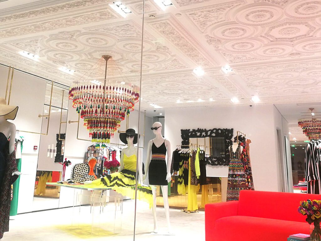 Alice&Olivia store interior - fashion clothes display showcases and racks in the store