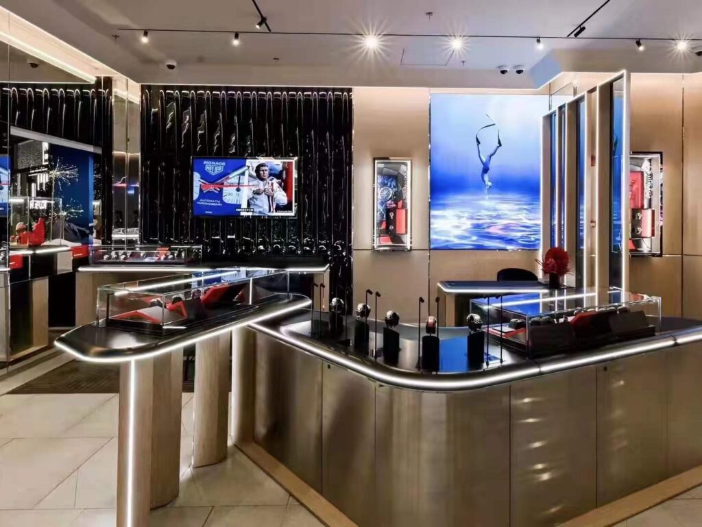 TAG HEUER store interior - luxury watch display showcases in the store
